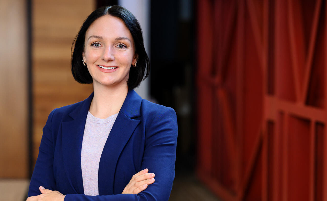 Woman appreciating the Value of Complementary Headshots